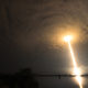 The bright trail of a rocket launch against the sky